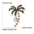Golden coconut tree brooch with green rhinestones and pearl detail for women - Gold