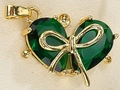 Green heart gemstone pendant with gold bow detail and metallic hanging loop - Green