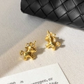 Elegantes pendientes de unicornio bañados en oro de 18k con piedras de circonita blanca - Dorado