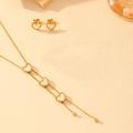 Golden stainless steel jewelry set with white heart charms on beige leather - Heart Jewelry Set
