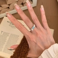 Vintage style silver ring with a bow design and an oval light blue center stone - Silver Bowknot Design Oval Light Blue Main Stone Ring (J5953)