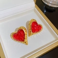 Vintage heart-shaped earrings with red resin center and textured gold metal frame - Heart Shape Red Stone Style