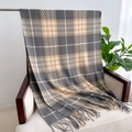 Close-up of grey and camel checkered scarf with tassels draped on a beige armchair - Gray & Camel Houndstooth (WT141-5)