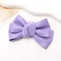 Close-up of light purple faux leather bow accessory with detailed grain texture - Purple