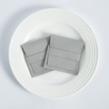 Detail of two gray microfiber suede jewelry pouches with a fold-over flap design - 8*8cm / Gray