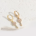 Golden key-shaped drop earrings with evil eye design and pink blue enamel accents - Key Style