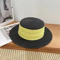 Flat top black straw sun hat with a contrasting yellow ribbon band and wide brim - M / Black with Green Ribbon