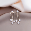 Elegant gold fringe earrings with white pearls and sparkling rhinestones on silk - Gold Heart Pearl Tassel