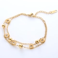 Double-layered gold stainless steel bracelet with Roman numeral crystal charms - Gold