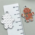 Brown gingerbread man charm with red and green enamel details for DIY Christmas jewelry - Brown Gingerbread Man 23x17mm
