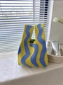 Knitted tote bag featuring a vibrant yellow and blue wave pattern for daily use - Wave Stripes