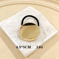 Punk style ponytail cuff with gold geometric metal plate on black elastic hair tie - Ellipse