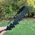 Matte black floral headband for women with 3D flower accents and non-slip design - Black
