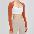 Bolero sportivo slim fit arancione bruciato con fori per i pollici per yoga e fitness - S / Sella
