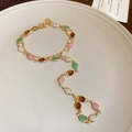 Detail view of vintage gold chain bracelet and ring set with colorful oval rhinestones - 28# Bracelet Double Layer Resin Oval Rice Bead