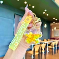 Cute yellow floral quicksand bottle keychain with Happy Moments silicone strap - Yellow Luminous Color Bean Flower