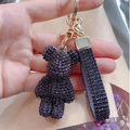 Sparkling crystal bear keychain in purple and black with matching rhinestone hand strap - Deep purple