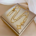 Macro view of gold square star pendant with pavé crystals and polished link chain - Gold Bow Star Style (J435)