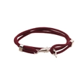 Close-up of deep red braided bracelet featuring a silver metal whale tail clasp closure - Dolphin / Burgundy