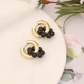 Detail of golden hoop earrings with black beads on a white ceramic plate and floral backdrop - Black Beaded Hoop Earrings (3#耳环)