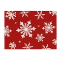 Detailed view of the woven fabric texture and festive white snowflake print on a red placemat - Style 6 (Red/White Snowflakes)