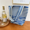 Detail of blue and white knitted tote bag texture with casual lifestyle scene props - 7 Wave Pattern Blue