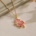 Golden butterfly necklace with pink enamel pendant on a soft beige textured surface - Pink Butterfly