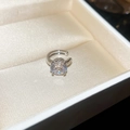 Detail of silver ear cuff with sparkling round zircon in a beige jewelry gift box - Round Ear Clip Style / Silver
