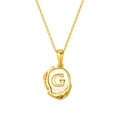 Titanium gold plated necklace with shell disc and letter G in lava metal frame - Letter G