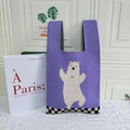 Purple knit tote bag featuring white polar bear pattern and checkered edge design - Dancing Bear Purple