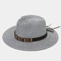 Detail of blue and white woven straw hat with brown leather band and shell ornaments - One Size / Dark Blue
