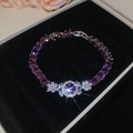 Detailed macro view of zircon flower bracelet with purple gems on black velvet - Bracelet-Purple Flower