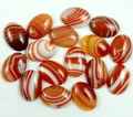 Polished oval agate gemstones with orange and white stripes for DIY jewelry making - Orange Banded Agate