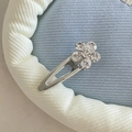Close-up of a silver metal hair clip featuring a delicate rhinestone flower detail - Silver Triangle Hollow Clear Rhinestone Flower