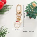 Cartoon Santa Claus keychain with gold finish, pearl accent and precise dimensions - White Beard Santa