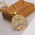 Gold plated tree of life pendant necklace with colorful zircon stones on a wooden block - Gold Tree of Life - Enhanced Colorful Stone Style