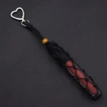 Detail of handmade woven lipstick holder with silver heart clasp and wooden bead - Black
