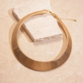 Detailed view of bold golden wide collar necklace with textured links and lobster clasp - Gold