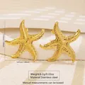 Golden stainless steel starfish earrings with textured surface and minimalist ocean design - Stainless Steel Starfish Textured