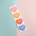 Strip of 4 colorful heart-shaped Thank You stickers in pink yellow red and blue - Heart