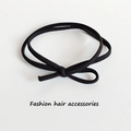 Elastic black double-strand hair tie with minimalist bow knot on white background - 1 Piece / Black