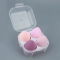Set of 4 soft purple-toned makeup sponges in a transparent plastic storage box - 4-Grid Transparent Pink Series