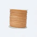Close-up of 0.8mm light orange braided cord on a spool for jewelry and DIY crafts - Color 180 Light Beige