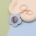 Light blue flower shaped PU leather keychain with built-in mirror and gold hardware - Flower Light Blue