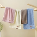 Detail of embroidered cartoon bear on soft colorful cotton towel with fabric texture - Embroidered Bear Head Mixed Colors