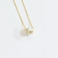 Golden chain necklace featuring a white donut pendant with evil eye and star motifs - White Evil Eye