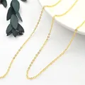 Macro shot of minimalist gold S925 sterling silver O-link chain with fine oval ring texture - Gold Bare Chain