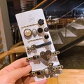 Detail of 6-piece hair clip set featuring vintage roses, metal bear, and pearl elements - Two Teddy Bears 6-piece Set