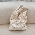 Detail of white puffer tote bag with embossed bear pattern and soft bubble fabric texture - Puppy Bear