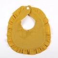 Detail of ginger yellow ruffled baby bib made from breathable cotton crepe with snap button - Ginger Yellow